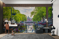 City of Bikes Wall Mural showing colorful bicycles along an Amsterdam canal.

