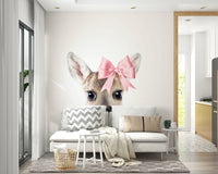 Deer with a bow wall mural capturing nature’s beauty.

