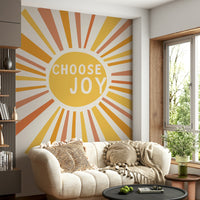 Vibrant Choose Joy mural with rays of sunshine and color

