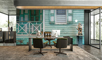 Turquoise wall mural with aged coastal house details.

