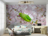 Parakeet wall mural with soft pink floral background.


