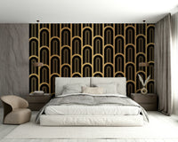Bold geometric wallpaper mural with gold arches on black background.

