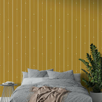 Soft mustard stripes adding texture and warmth to walls

