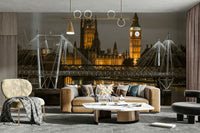 Illuminated Big Ben and the Golden Jubilee Bridge at night

