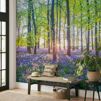 Vibrant purple-blue flowers in a woodland setting

