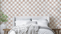 Hand-painted pink gingham wallpaper with a festive design

