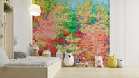 The mural shows a dense forest of trees with colorful fall leaves.

