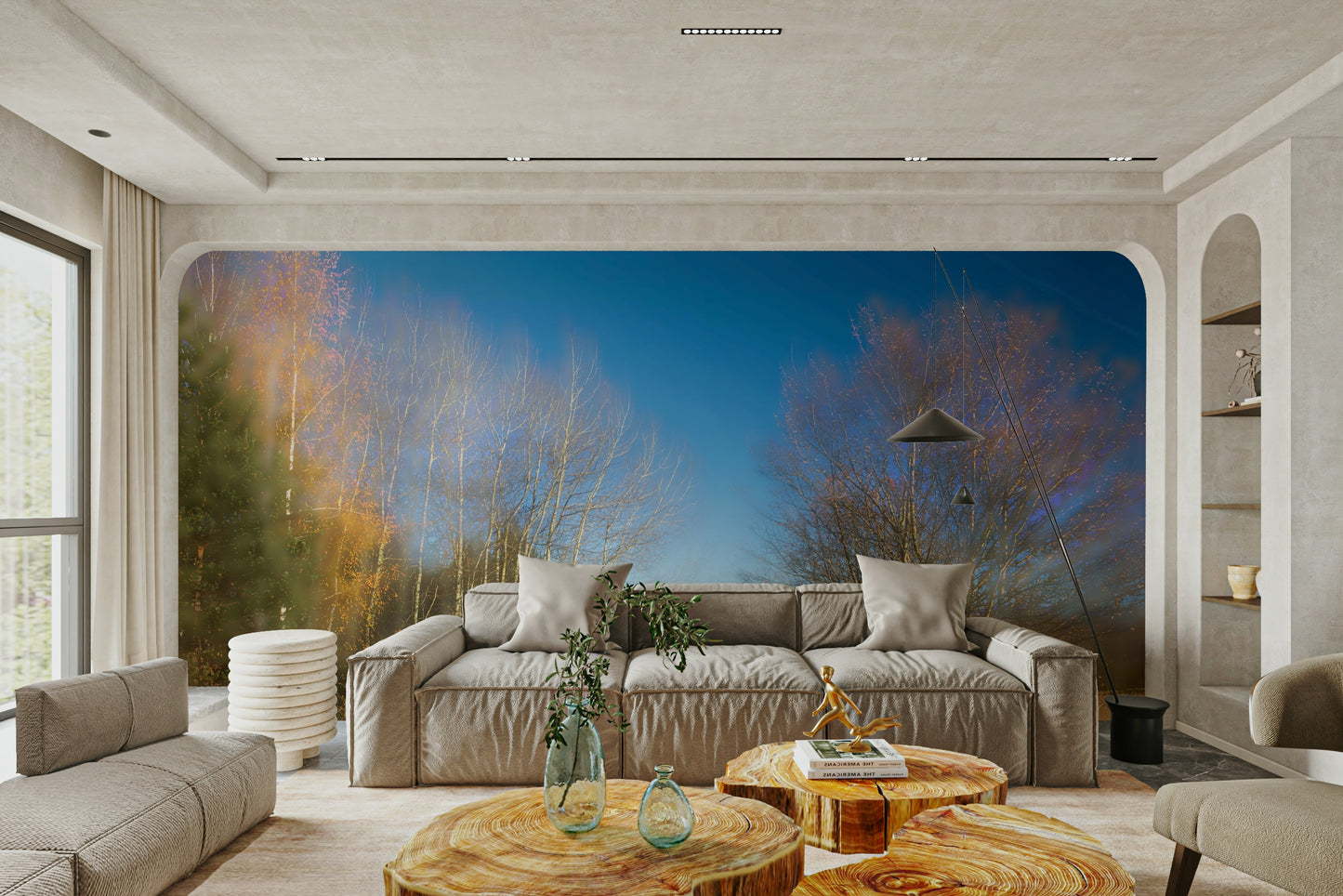 A photo-realistic wall mural of an autumn landscape in a light-filled room.

