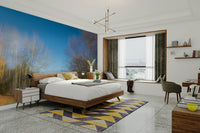 The room's decor is simple and modern, allowing the mural to stand out.

