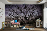 The mural shows a moody landscape with a dramatic sky in the background.
