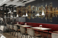 Contrast between illuminated buildings and dark water.

