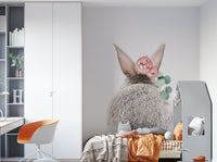 Focus on the bunny's fluffy tail and the surrounding blooms.

