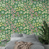 Dark green background with green leaves.

