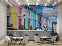 Mural with a blue sky and white clouds.

