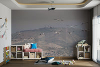 Rolling hills or mountains are depicted below.
