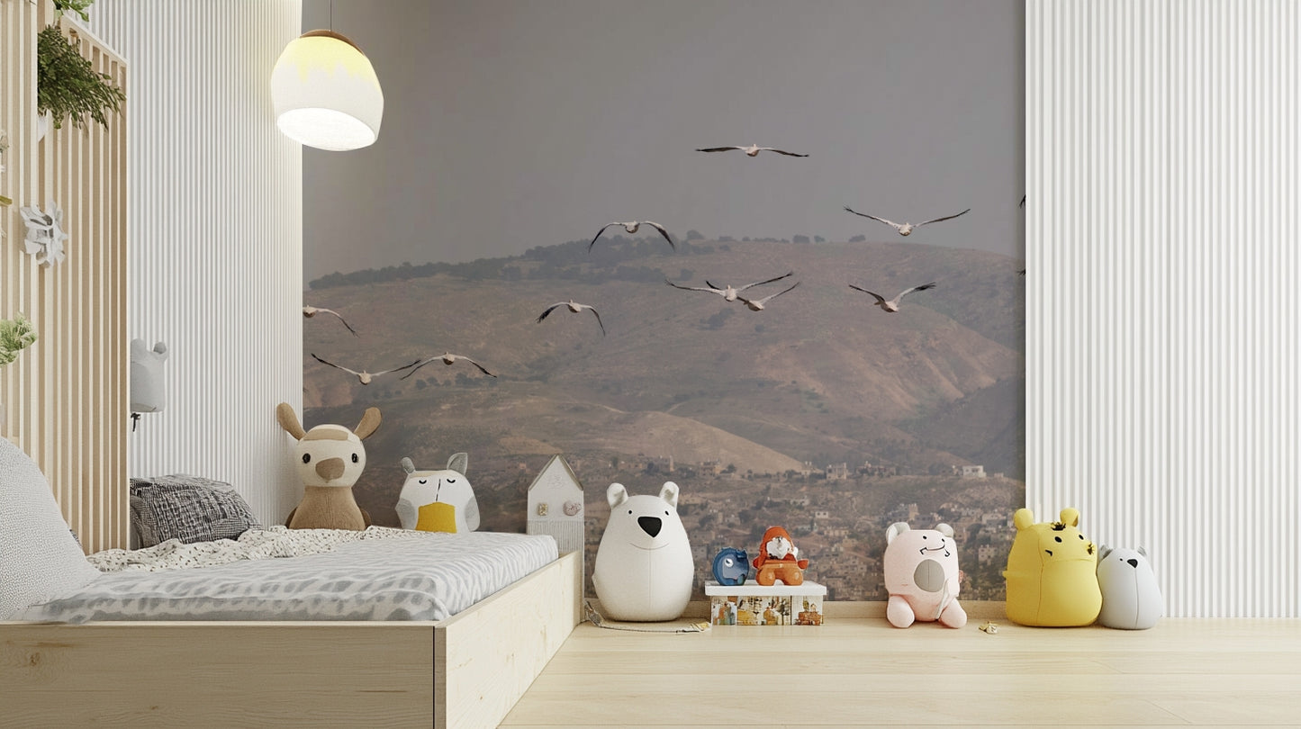 Features birds flying gracefully in an open sky.
