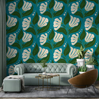 The background is a distinctive avocado teal.
