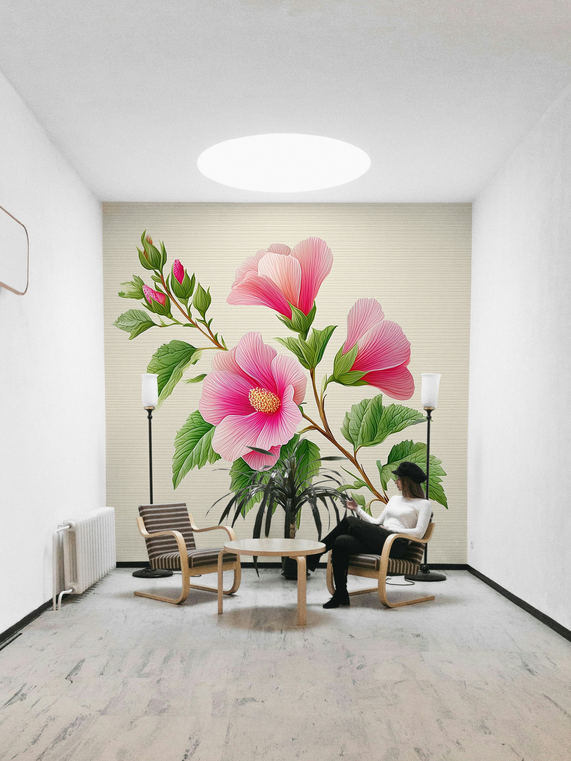 large hibiscus blooms on a wall

