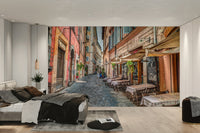 A wall mural of a cafe scene in Rome.

