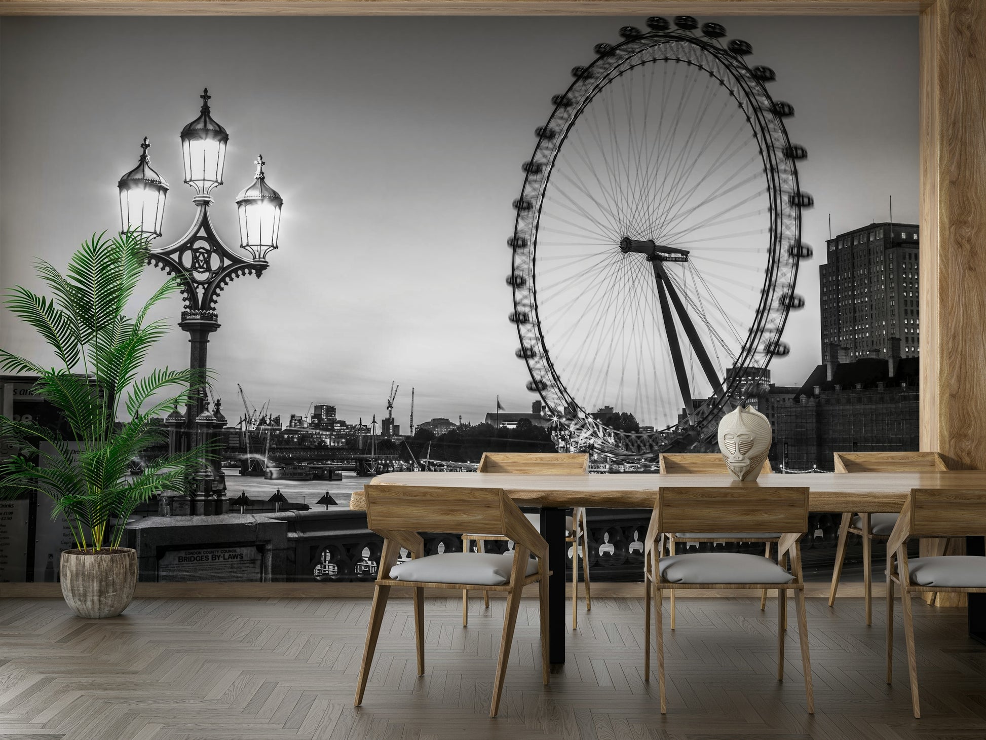 A wall mural with an artistic design of a lamp and a wheel.

