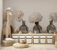 A close-up view of a peony and its reflection in the vase.

