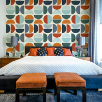 A mid-century modern wall mural with a repeating pattern of circles.

