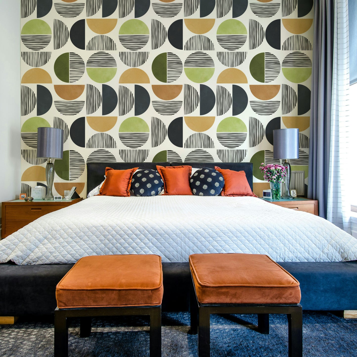 The room feels warm and serene due to the elegant design.

