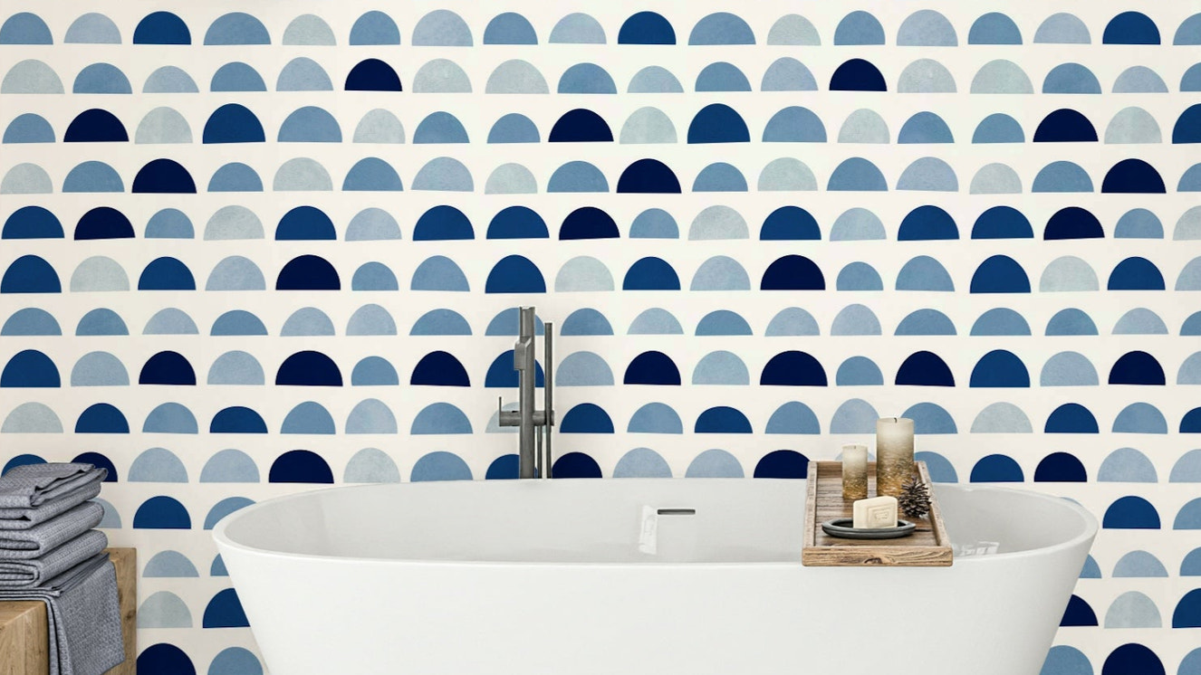 A modern wall mural with a repeating pattern of half-moon shapes.

