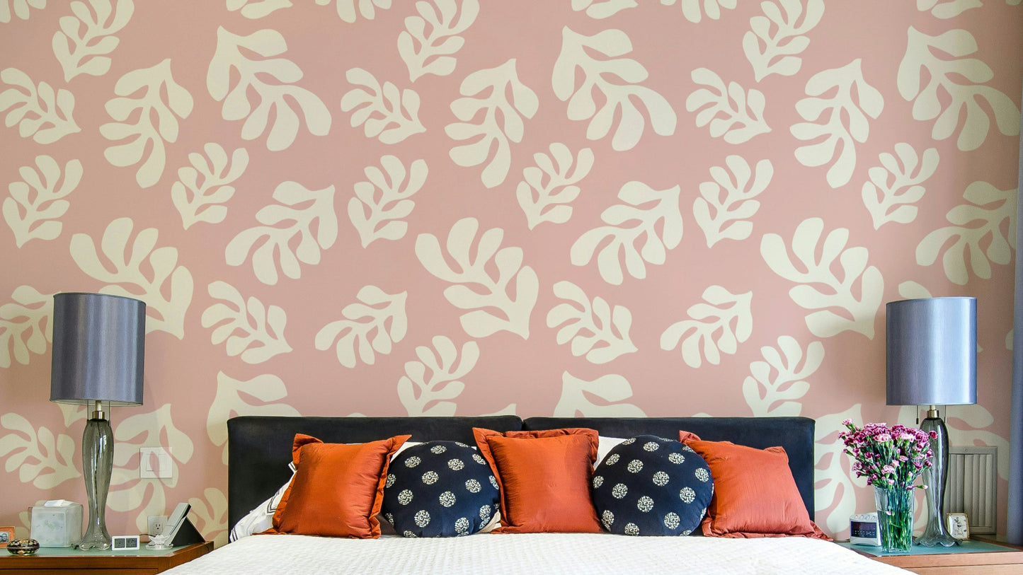 A photo-realistic wall mural with a repeating pattern of soft pink leaves.

