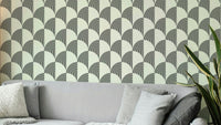 A modern wall mural with a repeating geometric arc pattern.

