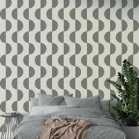 The wallpaper is applied seamlessly, giving the wall a uniform look.

