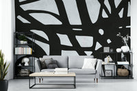 The room feels dramatic and chic due to the dark, elegant design.

