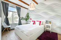 The wall mural is installed on a living room feature wall.

