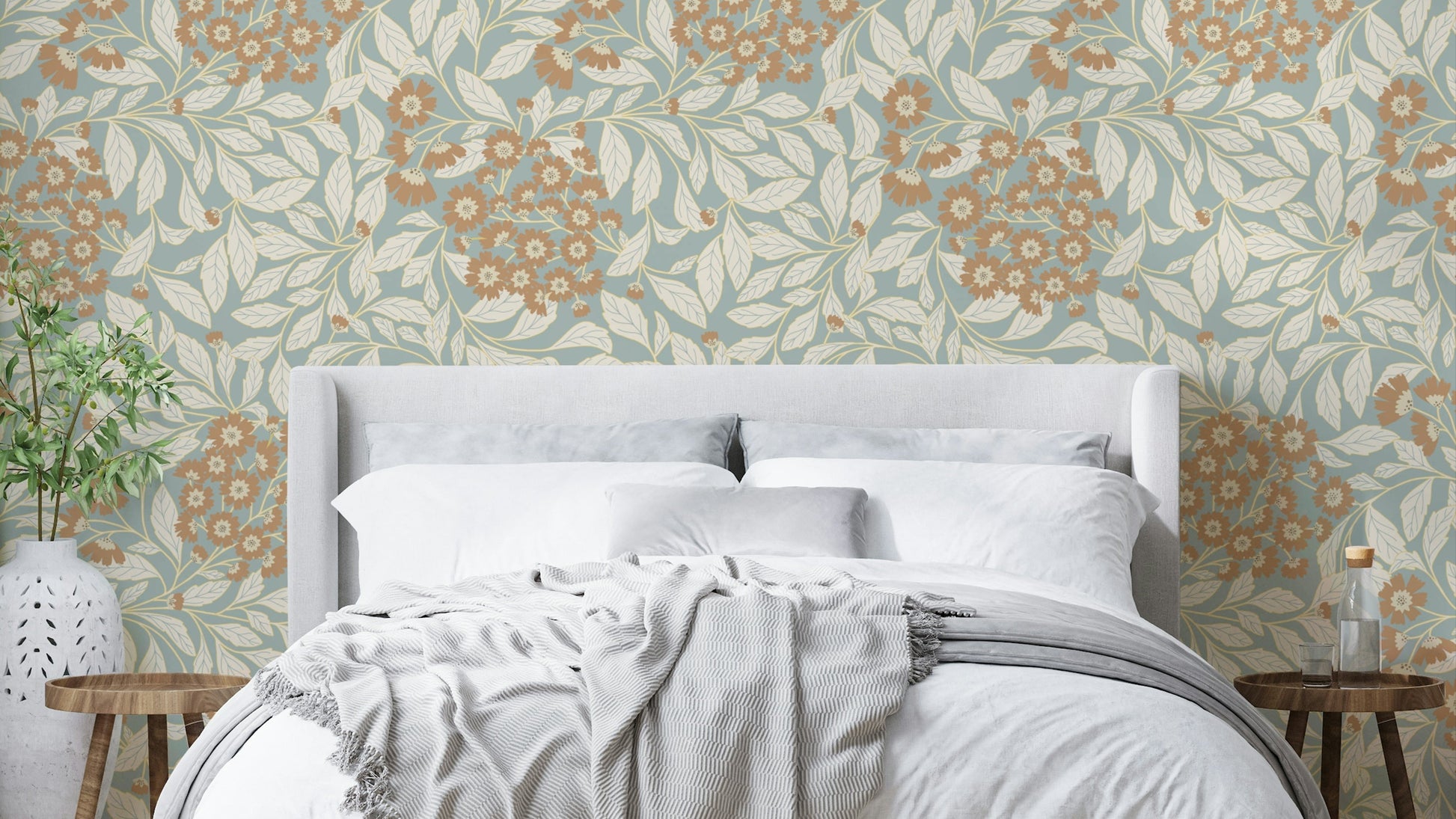 The image shows a repeating pattern of rustic flowers and leaves.

