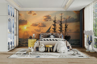 A detailed image of a wall mural featuring a sailboat at sunset.

