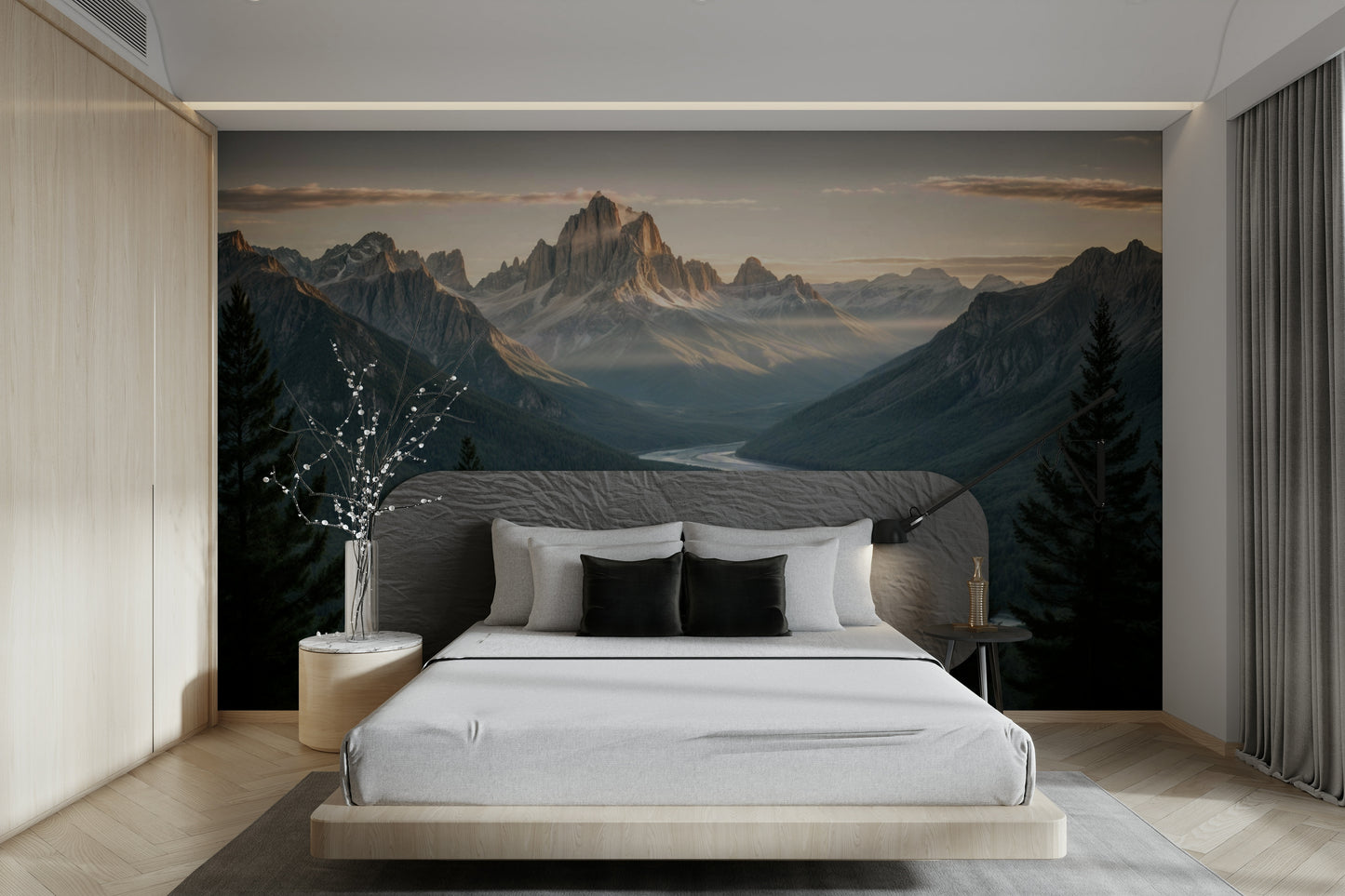 A wall mural of a peaceful mountain landscape with a river.

