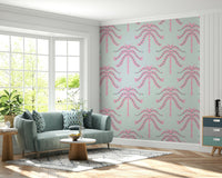 A wall mural of a tropical palm leaf pattern.

