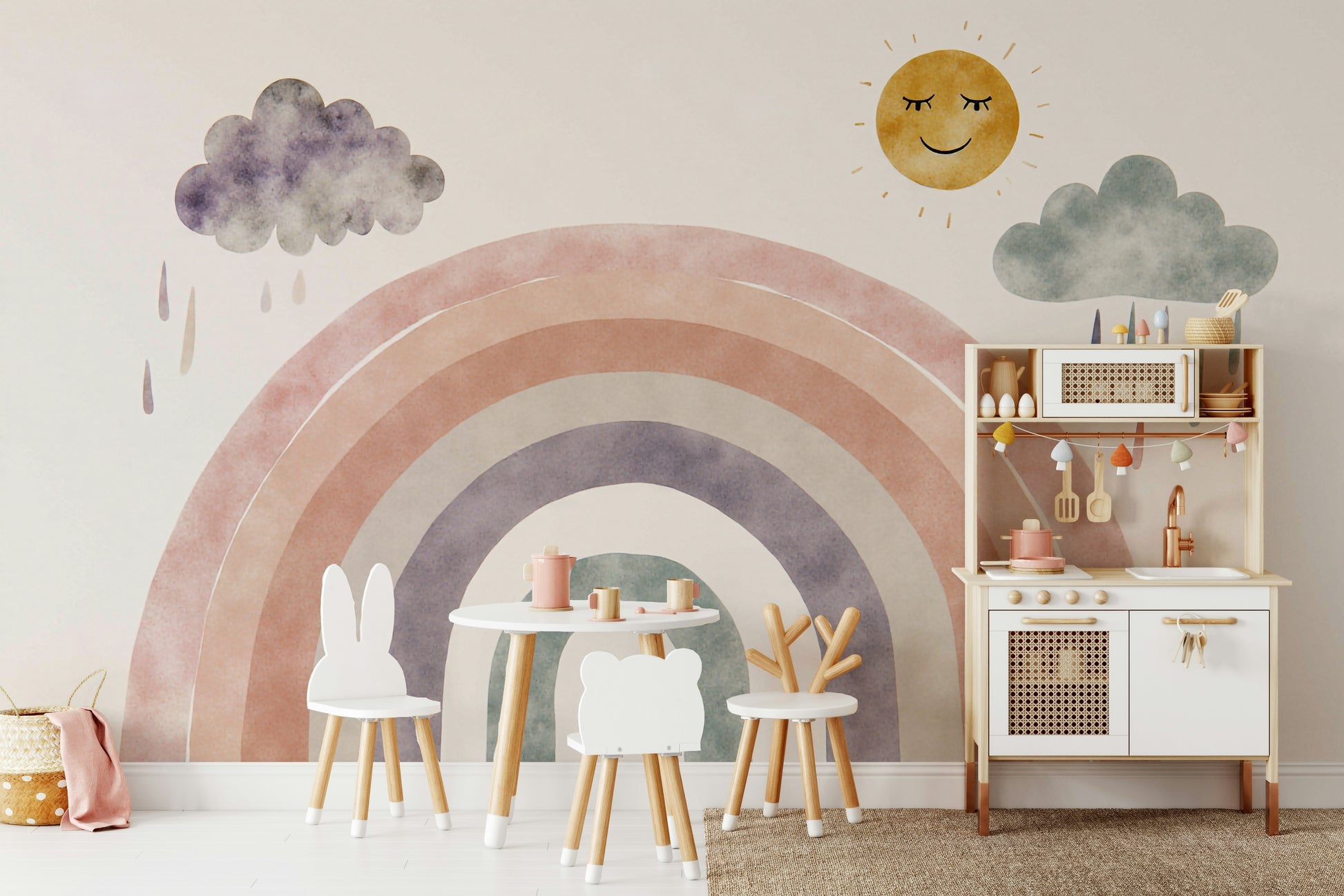 A wall mural of a smiling cartoon sun and a rainbow.
