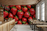 The design shows ripe red strawberries with green leaves and white flowers.
