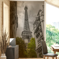 The buildings and tower are in black and white.

