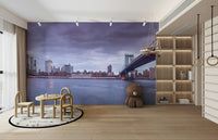 The colors are soft and gentle, with deep blues and warm golden lights.

