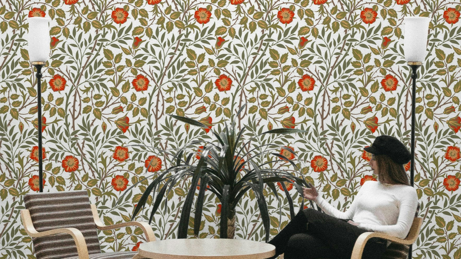 A wallpaper featuring a classic, intricate floral pattern.

