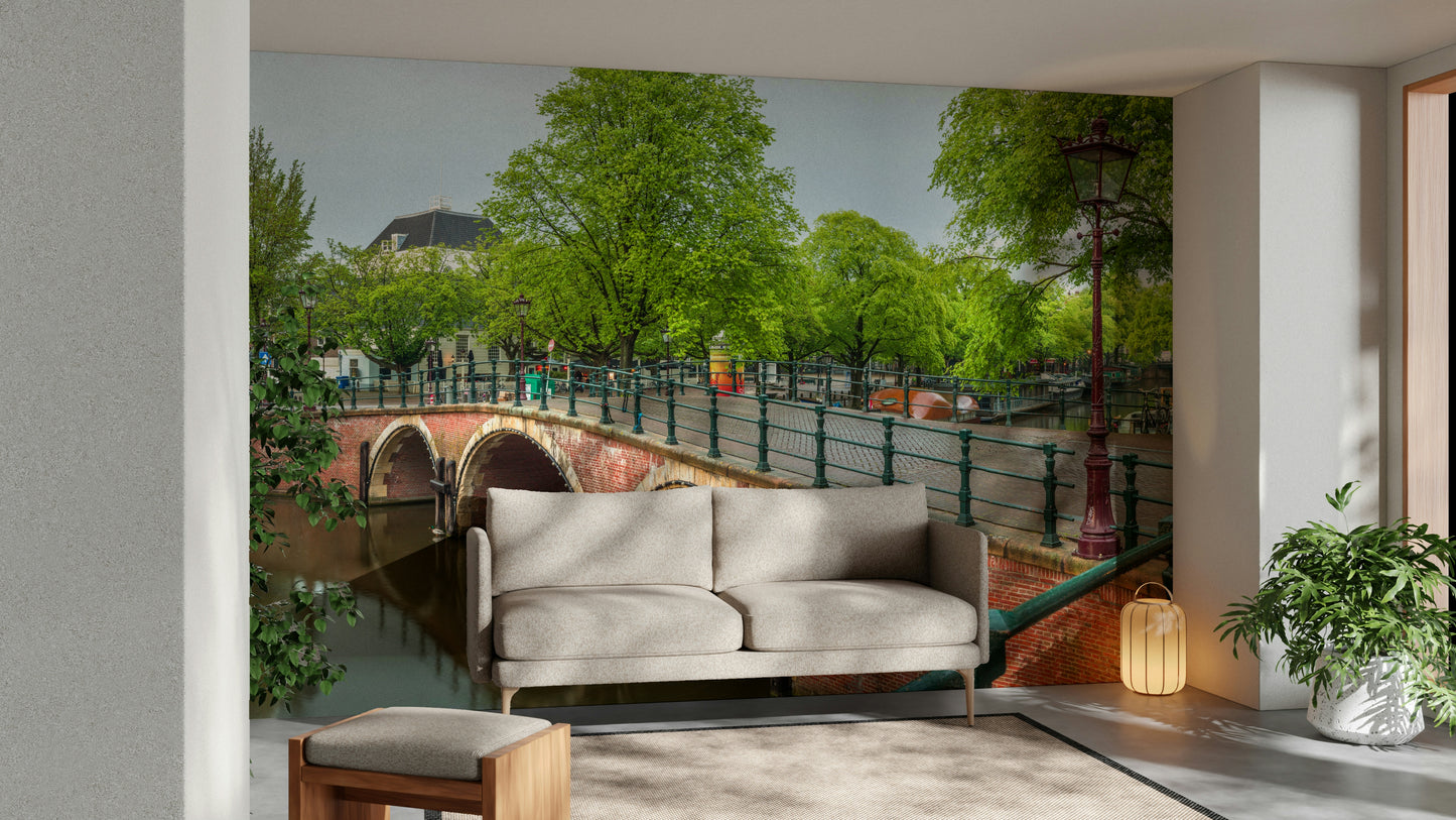 The mural is installed in a calm living room behind a simple, light-colored sofa.

