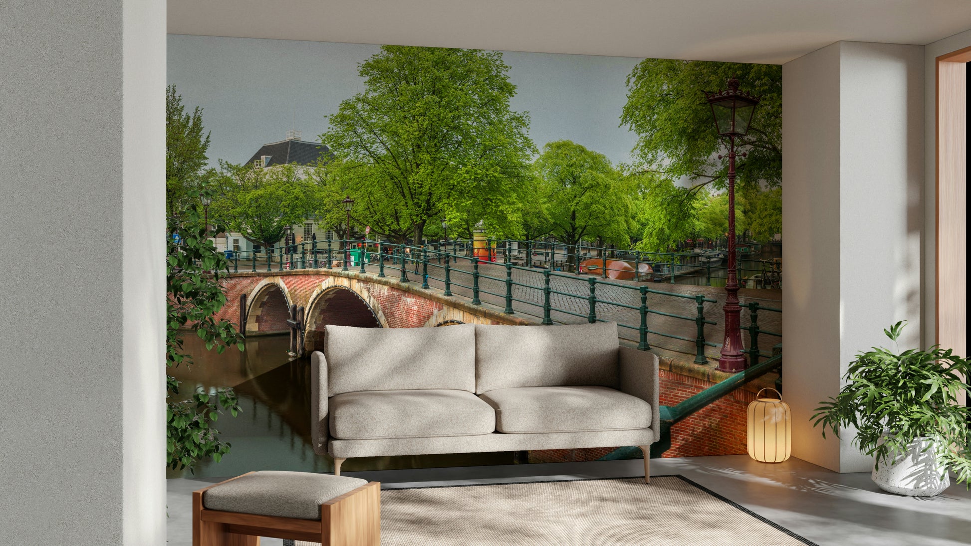 The mural is installed in a calm living room behind a simple, light-colored sofa.

