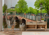 The image shows a serene view of a city with classic European buildings.

