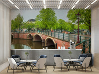 A close-up view shows the soft lines and details of the buildings and the water.

