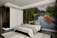 The image shows a serene boat, or punt, on a foggy river at dawn.

