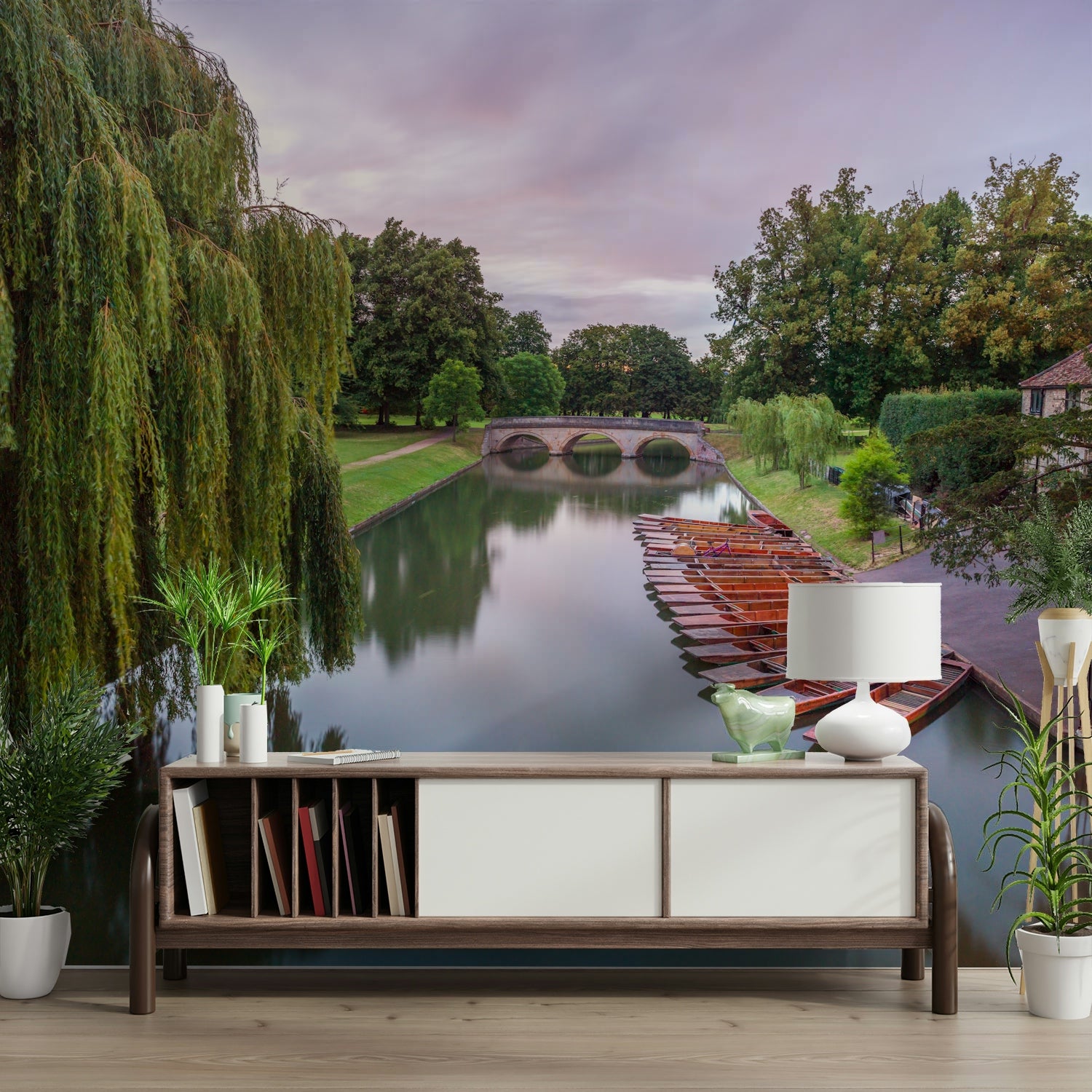 A close-up view shows the soft lines and details of the trees and the boat on the water.

