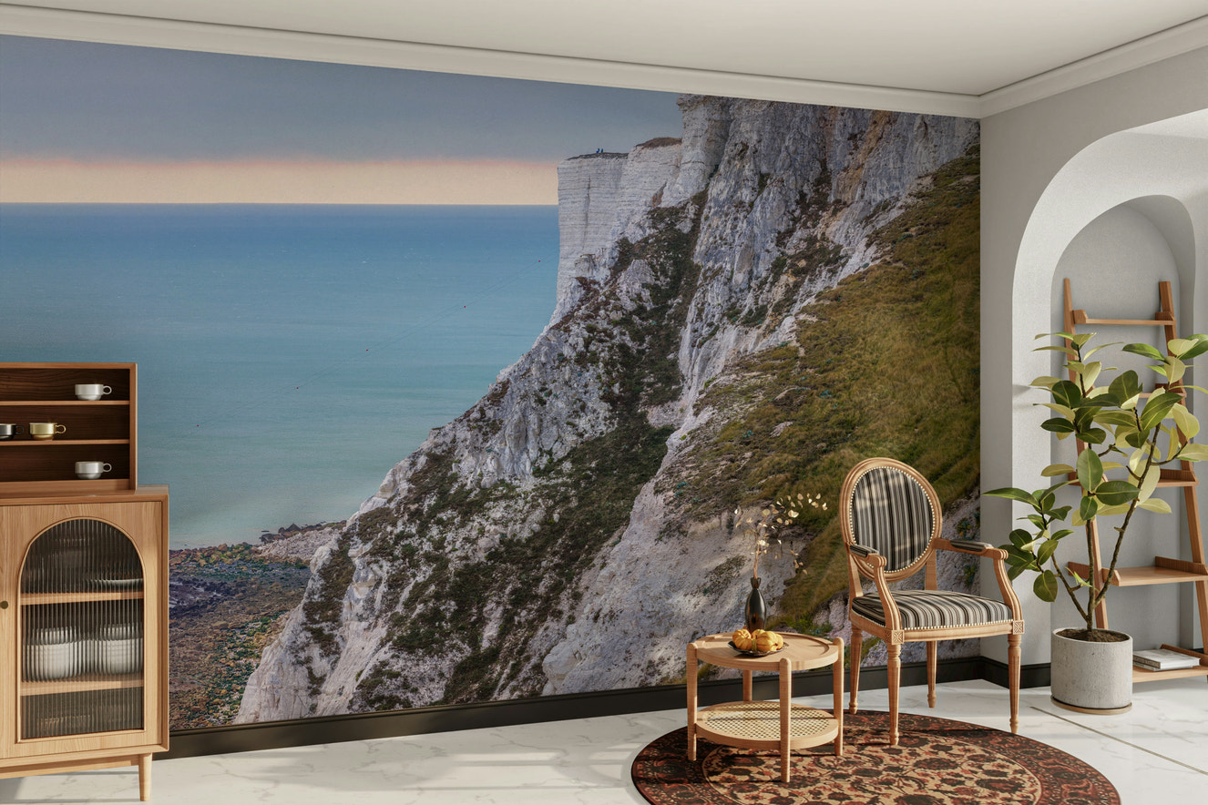 A wall mural featuring a peaceful, natural seascape scene.

