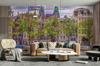 The mural shows a peaceful street scene with a canal and historic buildings.

